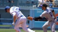 Colorado Rockies third baseman Nolan Arenado attempts to tag Los Angeles Dodgers outfielder Joc Pederson
