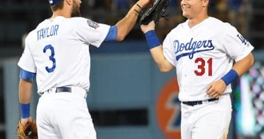 Los Angeles Dodgers teammates Joc Pederson and Chris Taylor celebrate after a win