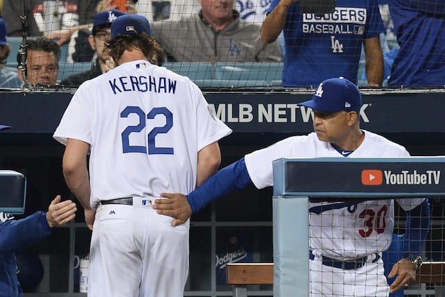 Los Angeles Dodgers manager Dave Roberts congratulates starting pitcher Clayton Kershaw