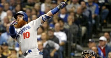 Los Angeles Dodgers third baseman Justin Turner hits a home run against the Milwaukee Brewers during the 2018 NLCS