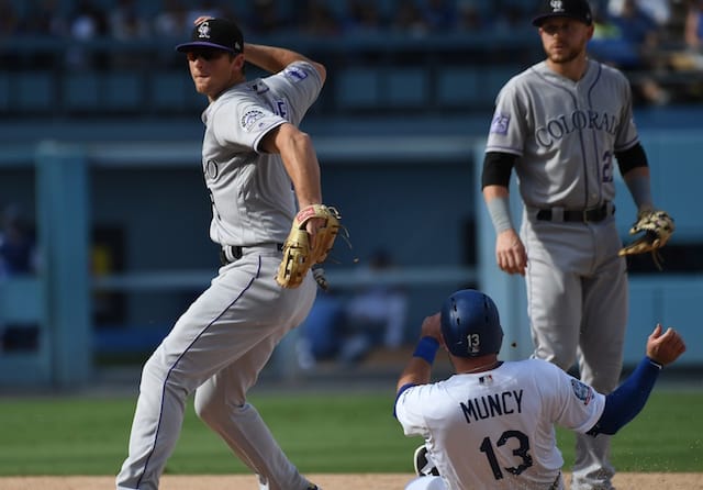 Los Angeles Dodgers infielder Max Muncy slides into second base