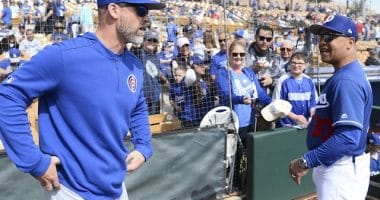 Los Angeles Dodgers manager Dave Roberts speaks with former Chicago Cubs catcher David Ross
