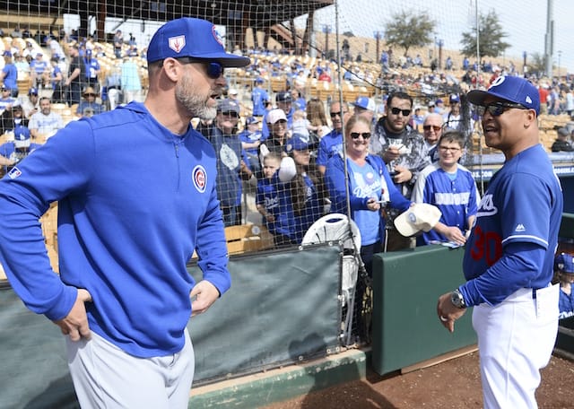 Los Angeles Dodgers manager Dave Roberts speaks with former Chicago Cubs catcher David Ross