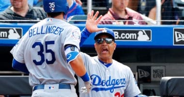 Los Angeles Dodgers manager Dave Roberts congratulates Cody Bellinger