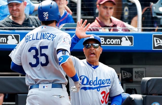 Los Angeles Dodgers manager Dave Roberts congratulates Cody Bellinger