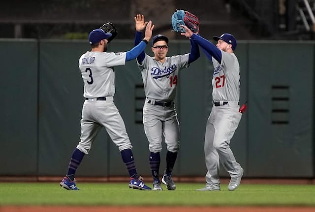 Kiké Hernandez, Chris Taylor and Alex Verdugo celebrate after a Los Angeles Dodgers win