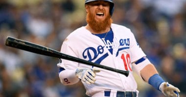 Los Angeles Dodgers third baseman Justin Turner reacts after being hit by a pitch