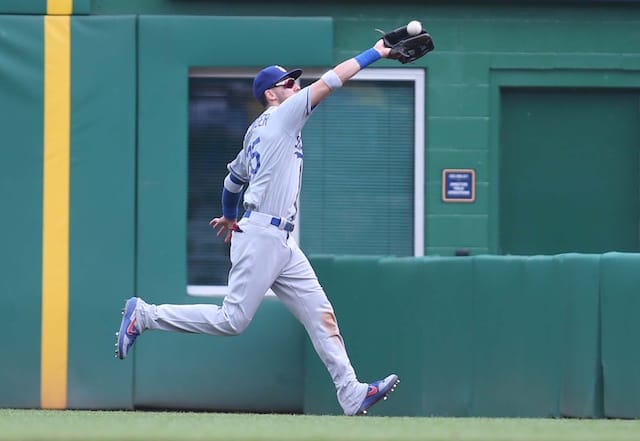 Los Angeles Dodgers right fielder Cody Bellinger makes a running catch against the Pittsburgh Pirates