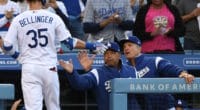 Los Angeles Dodgers manager Dave Roberts and bench coach Bob Geren greet Cody Bellinger after a home run