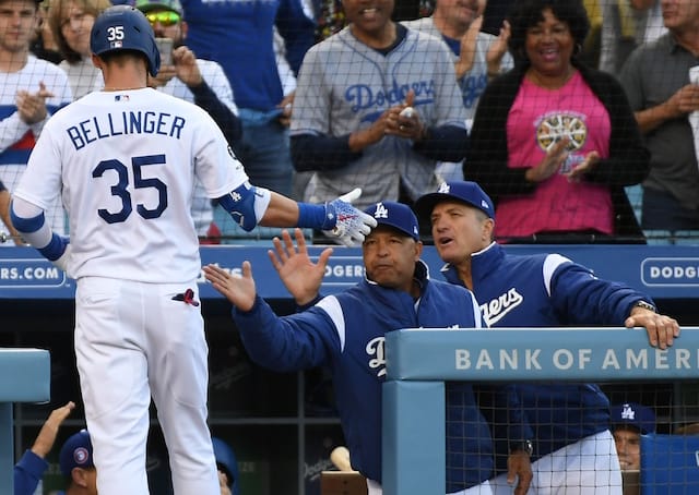 Los Angeles Dodgers manager Dave Roberts and bench coach Bob Geren greet Cody Bellinger after a home run