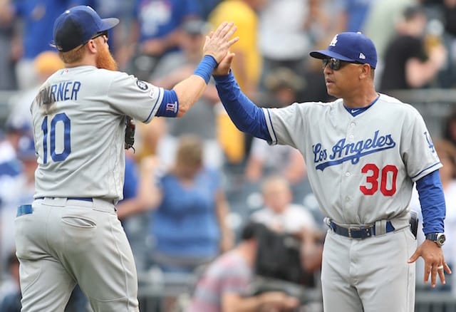 Los Angeles Dodgers manager Dave Roberts and Justin Turner celebrate defeating the Pittsburgh Pirates