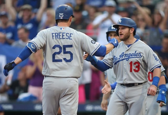 Los Angeles Dodgers infielder David Freese celebrates with Russell Martin after hitting a grand slam