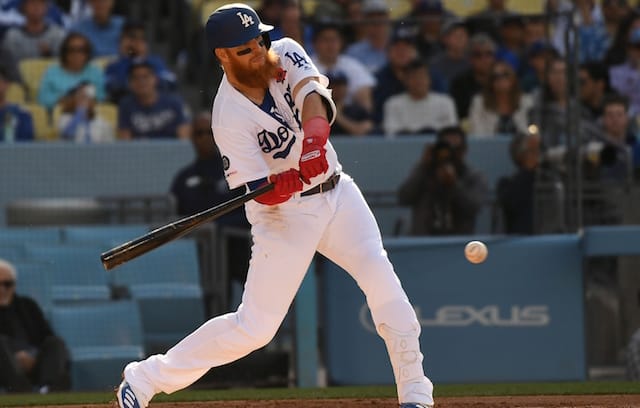Los Angeles Dodgers third baseman Justin Turner gets a hit against the New York Mets