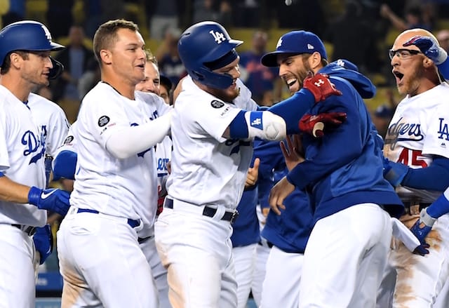 Matt Beaty, David Freese, Joc Pederson, Chris Taylor and Alex Verdugo celebrate a Los Angeles Dodgers walk-off win