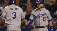Los Angles Dodgers teammates Max Muncy and Chris Taylor celebrate during a game against the Pittsburgh Pirates