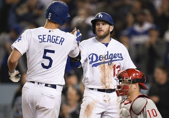 Los Angeles Dodgers shortstop Corey Seager celebrates with infielder Max Muncy after hitting a home run against the Philadelphia Phillies