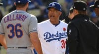 New York Mets manager Mickey Callaway and Los Angeles Dodgers manager Dave Roberts speak with umpires prior to a game at Dodger Stadium