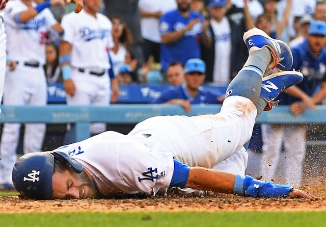 Los Angeles Dodgers shortstop Chris Taylor dives into home plate against the Chicago Cubs