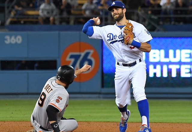 Los Angeles Dodgers shortstop Chris Taylor makes a throw to first base