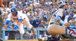 Los Angeles Dodgers shortstop Chris Taylor dives into home plate against the Chicago Cubs