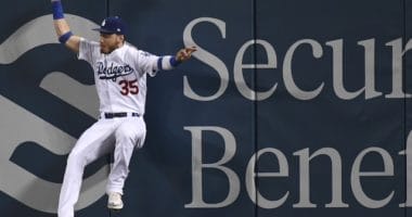 Los Angeles Dodgers right fielder Cody Bellinger makes a leaping catch at the wall