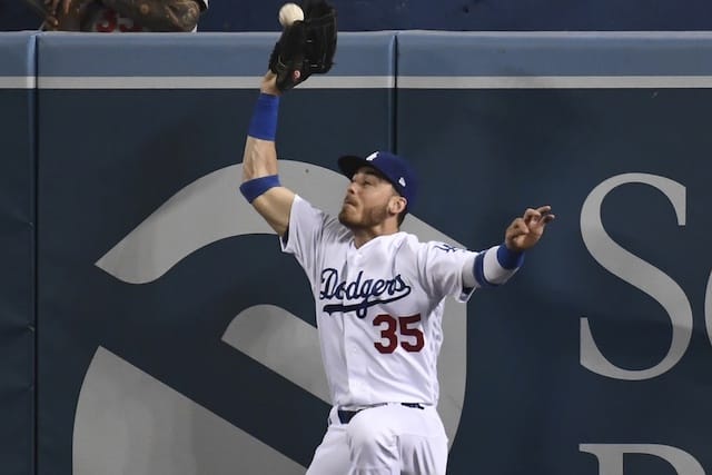 Los Angeles Dodgers right fielder Cody Bellinger makes a leaping catch at the wall