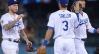 Cody Bellinger, Chris Taylor and Alex Verdugo celebrate after a Los Angeles Dodgers win at Dodger Stadium
