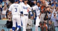 Cody Bellinger and Justin Turner congratulate Chris Taylor after his home run gives the Los Angeles Dodgers a lead against the San Francisco Giants