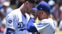 Los Angeles Dodgers manager Dave Roberts speaks with Cody Bellinger after a foul ball hits a fan at Dodger Stadium