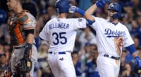 Los Angeles Dodgers teammates Cody Bellinger and David Freese celebrate after a home run against the San Francisco Giants