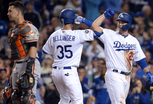 Los Angeles Dodgers teammates Cody Bellinger and David Freese celebrate after a home run against the San Francisco Giants