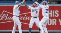 Cody Bellinger, JocPederson and Alex Verdug celebrate after the Los Angeles Dodgers defeat the Chicago Cubs