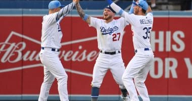 Cody Bellinger, JocPederson and Alex Verdug celebrate after the Los Angeles Dodgers defeat the Chicago Cubs