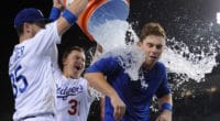 Los Angeles Dodgers teammates Cody Bellinger and Joc Pederson empty a Gatorade cooler on Will Smith after his walk-off home run