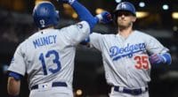 Los Angeles Dodgers teammates Cody Bellinger and Max Muncy celebrate after a home run