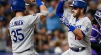 Los Angeles Dodgers teammates Cody Bellinger and Max Muncy celebrate after a home run against the Colorado Rockies