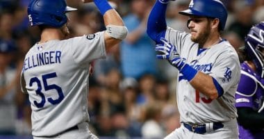Los Angeles Dodgers teammates Cody Bellinger and Max Muncy celebrate after a home run against the Colorado Rockies