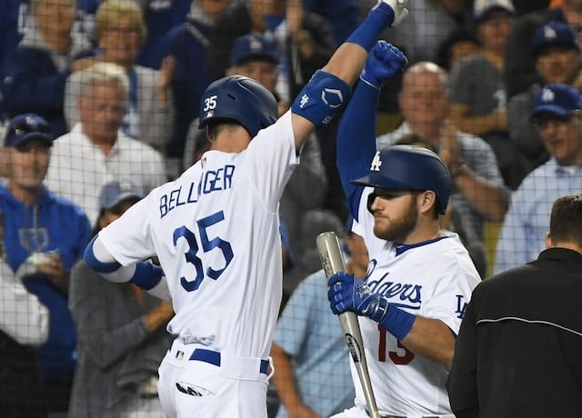 Los Angeles Dodgers right fielder Cody Bellinger celebrates with Max Muncy after hitting a home run against the Chicago Cubs