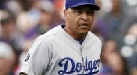 Los Angeles Dodgers manager Dave Roberts runs onto the field for a pitching change against the Colorado Rockies