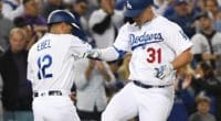 Los Angeles Dodgers third base coach Dino Ebel celebrates with Joc Pederson after a home run against the San Francisco Giants