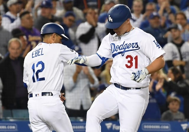 Los Angeles Dodgers third base coach Dino Ebel celebrates with Joc Pederson after a home run against the San Francisco Giants