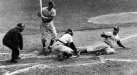 Jackie Robinson steals home plate during Game 1 of the 1955 World Series