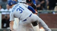 Los Angeles Dodgers outfielder Joc Pederson is tagged on his slide into home plate