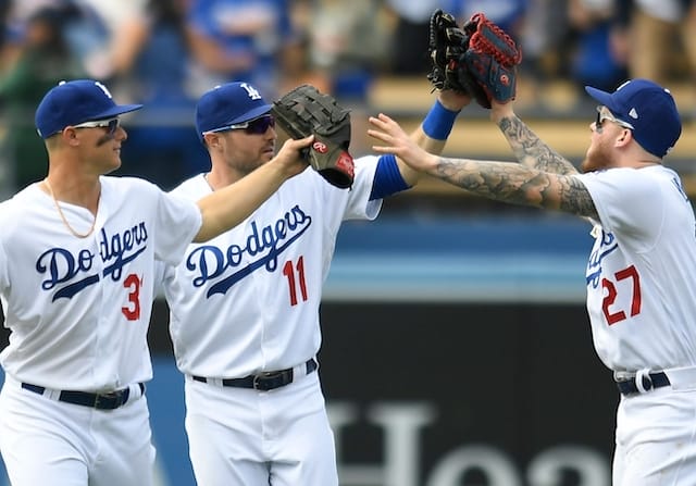 Los Angeles Dodgers outfielders Joc Pederson, A.J. Pollock and Alex Verdugo celebrate after a win