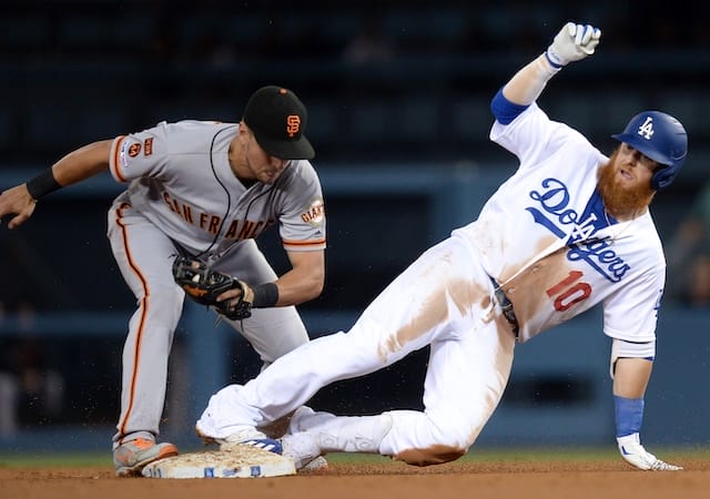 Los Angeles Dodgers third baseman Justin Turner slides into second base