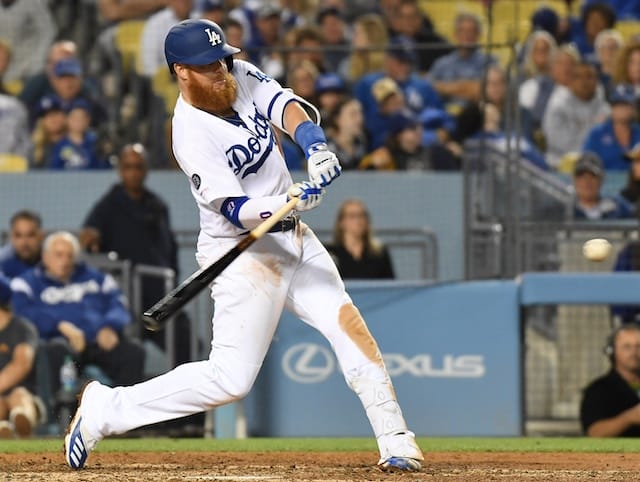 Los Angeles Dodgers third baseman Justin Turner hits a double against the San Francisco Giants