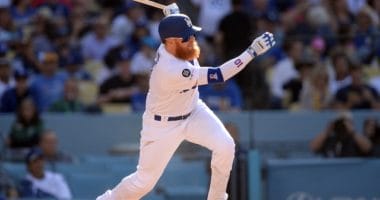 Los Angeles Dodgers third baseman Justin Turner hits an RBI single against the Colorado Rockies