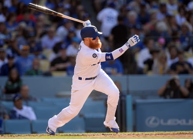 Los Angeles Dodgers third baseman Justin Turner hits an RBI single against the Colorado Rockies