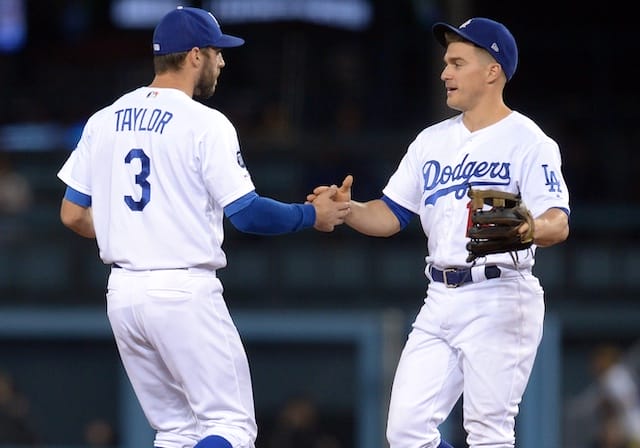 Kiké Hernandez and Chris Taylor celebrate after a Los Angeles Dodgers win at Dodger Stadium