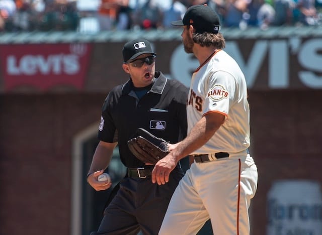 San Francisco Giants starting pitcher Madison Bumgarner talks with home-plate umpire Will Little